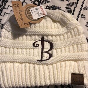 CC Exclusives girlie girl acrylic knit beanie in the color ivory
